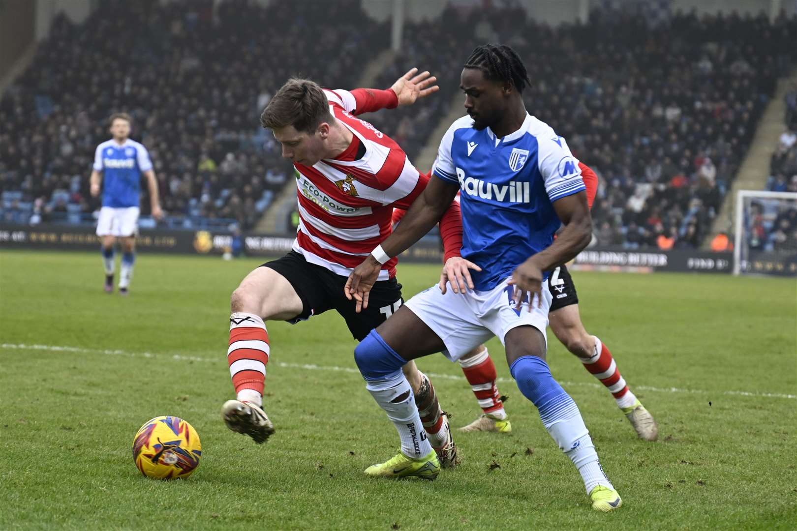 Aaron Rowe is kept at bay by Doncaster Rovers last Saturday - Gillingham’s fourth game without scoring Picture: Barry Goodwin