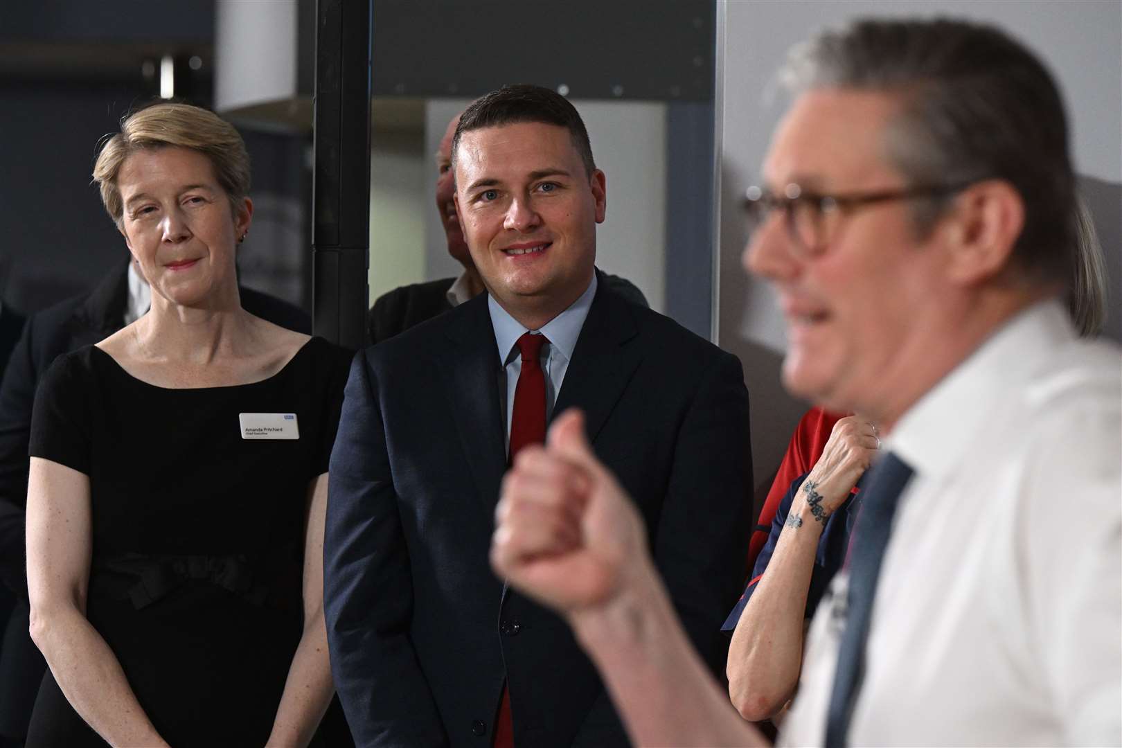 NHS chief executive Amanda Pritchard and Health Secretary Wes Streeting look on as Prime Minister Sir Keir Starmer delivers a speech at the Elective Orthopaedic Centre in Epsom, Surrey (Leon Neal/PA)