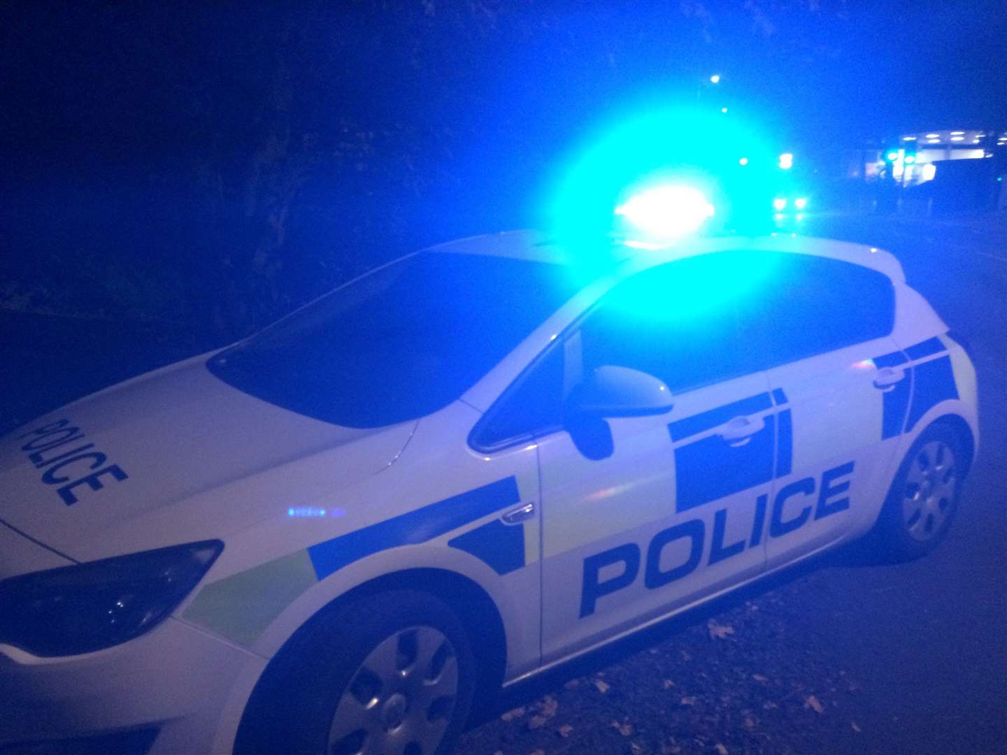 Stock image of a police car at night. (55462236)