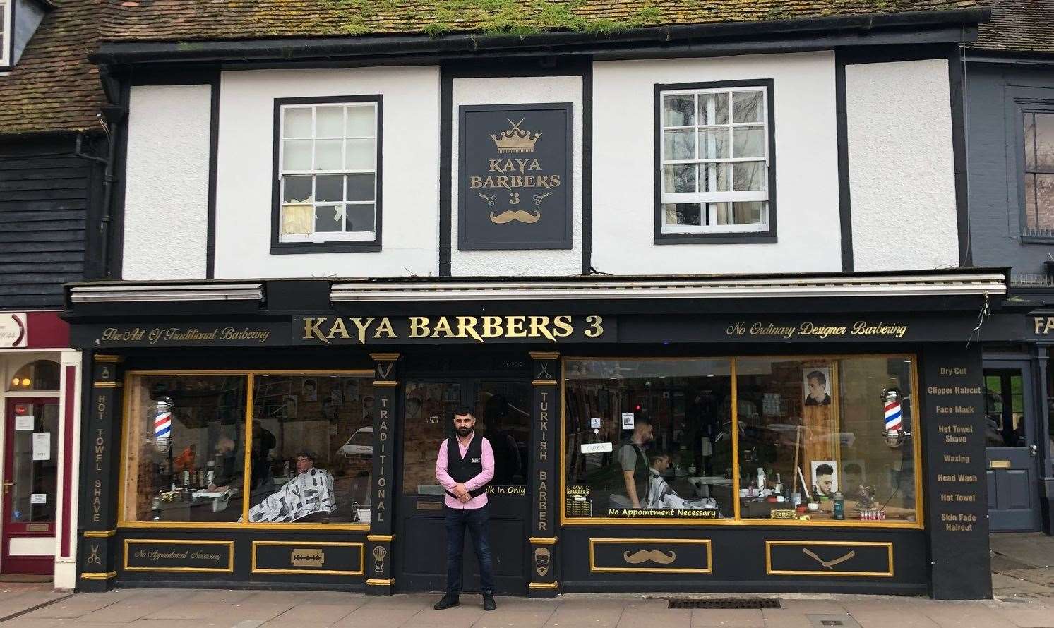 Cuneyt Kaya outside Kaya Barbers in Rochester