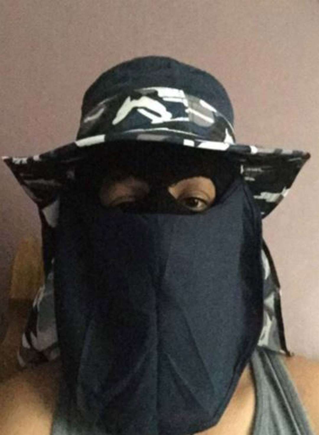 Sahayb Abu, 27, wearing a face covering and combat hat in one of a series of homemade videos he sent to his 32-year-old brother Muhamed Abu on June 30 last year (Met Police/PA)