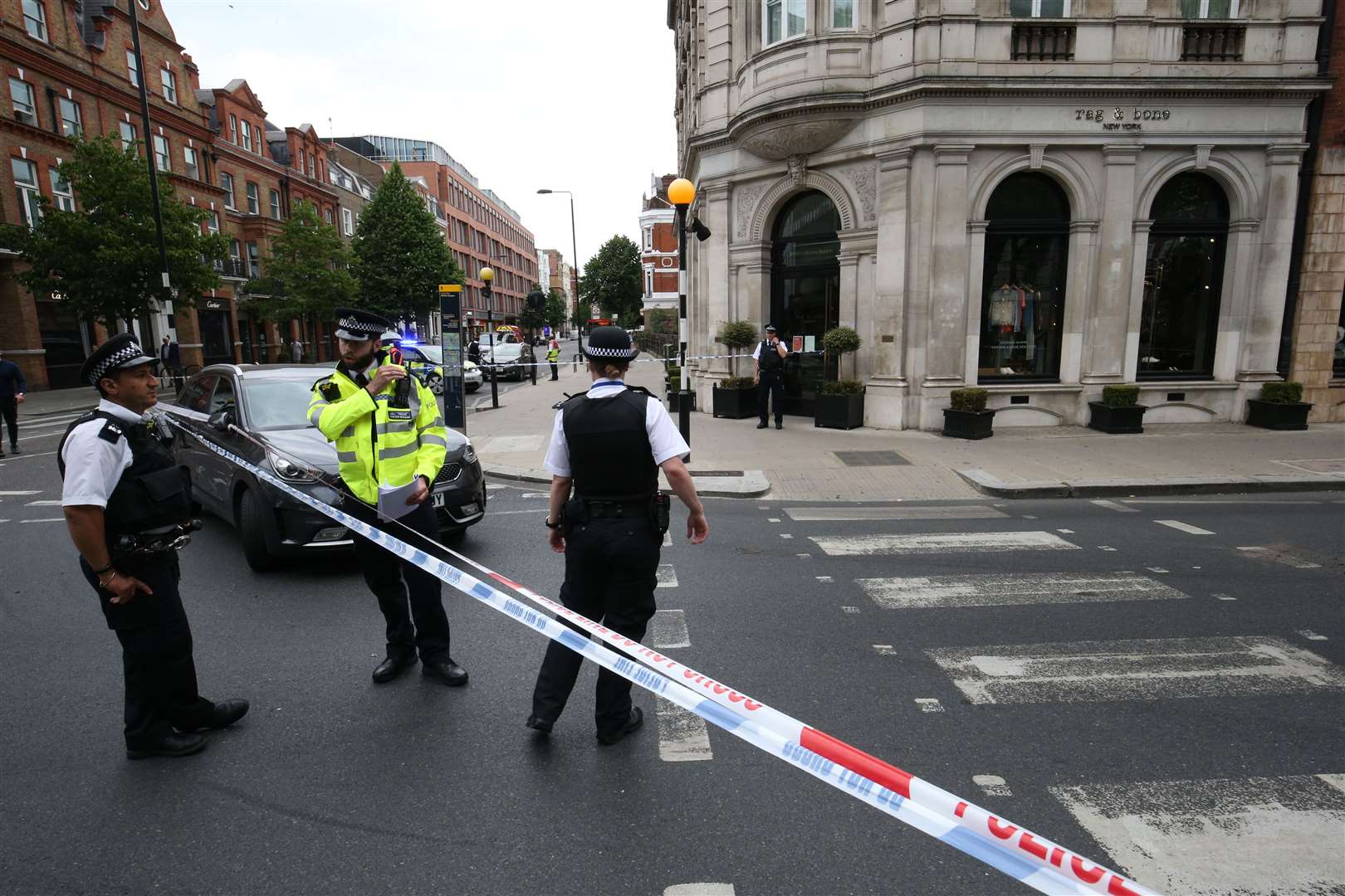 Police at the scene in Sloane Square, Kensington (Jonathan Brady/PA)