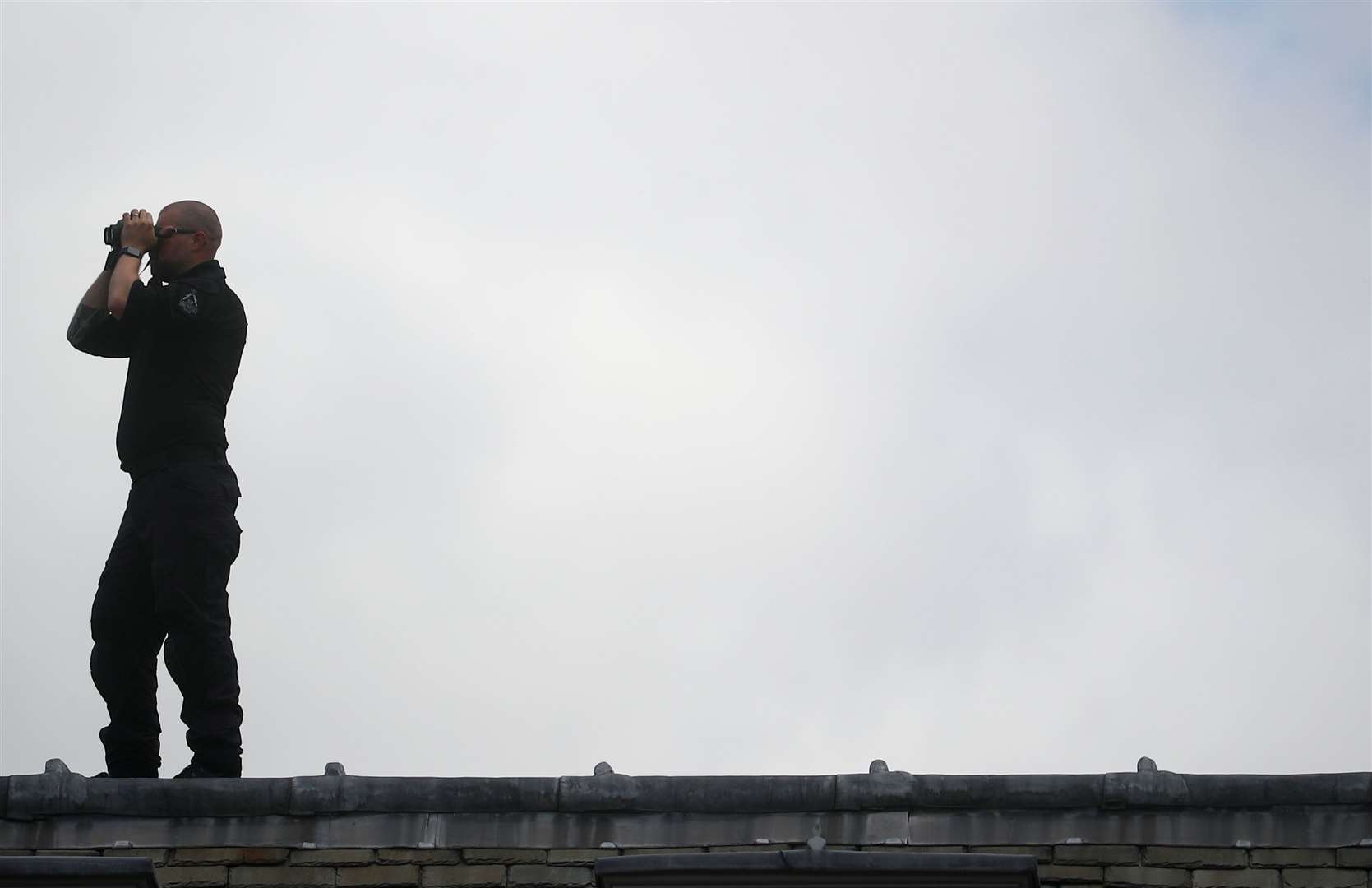 A security officer keeps watch at the Palace of Westminster (Hannah McKay/PA)