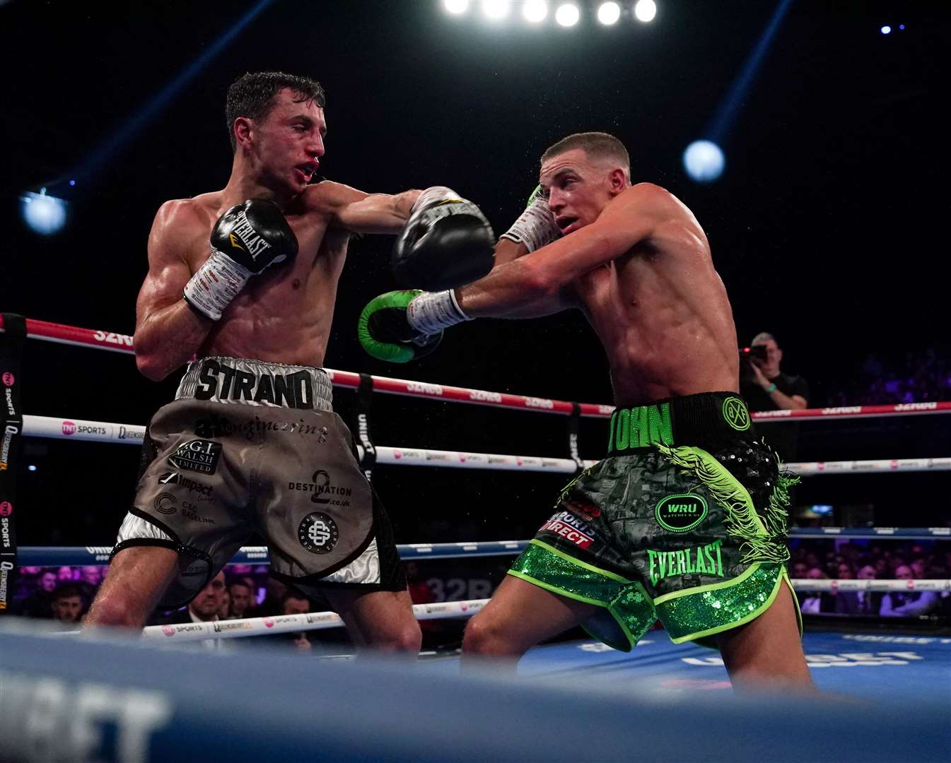 Dennis McCann (green) on his way to victory over Brad Strand last time out Picture: Stephen Dunkley / Queensberry Promotions