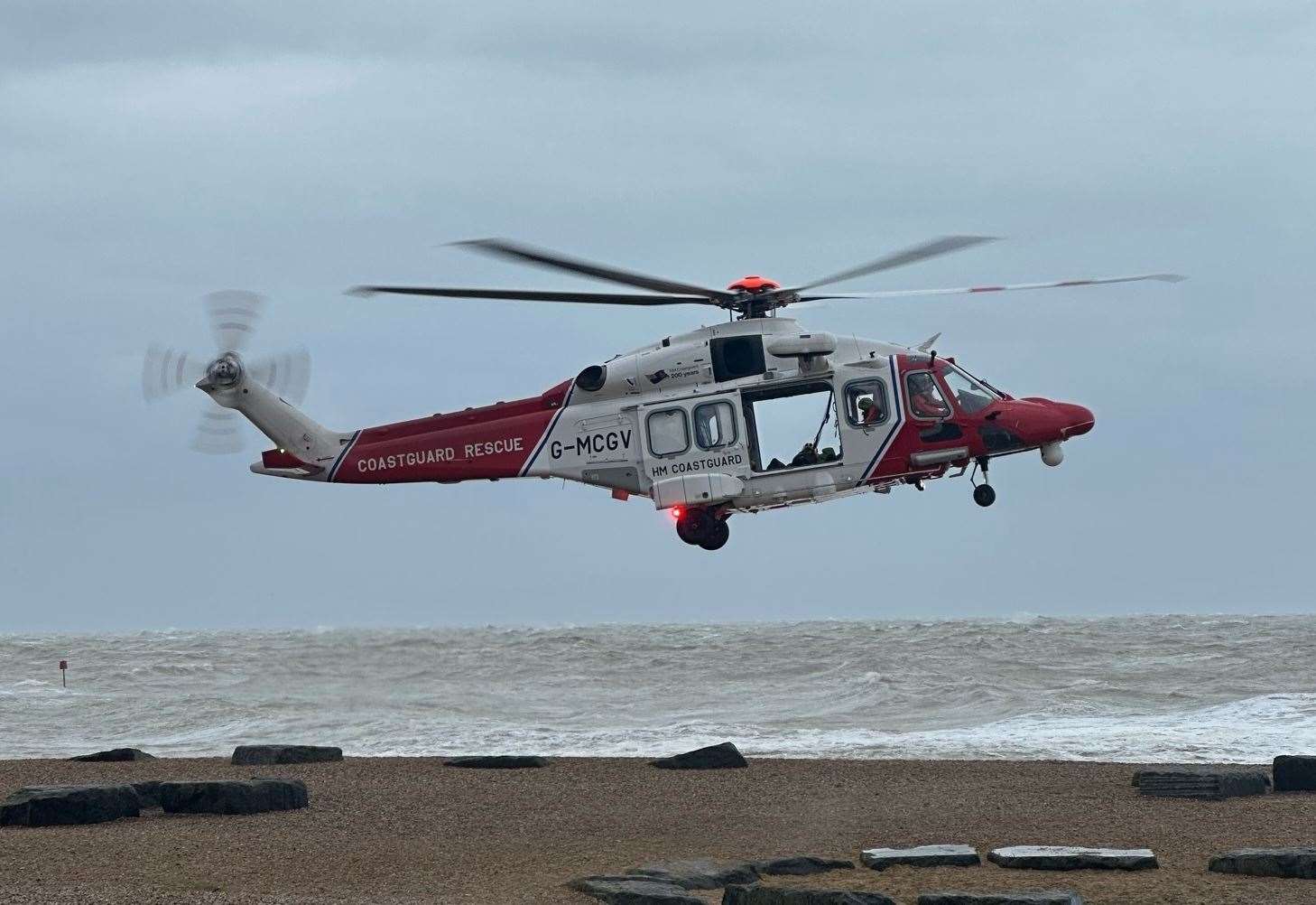 Crews help man in difficulty in stormy seas