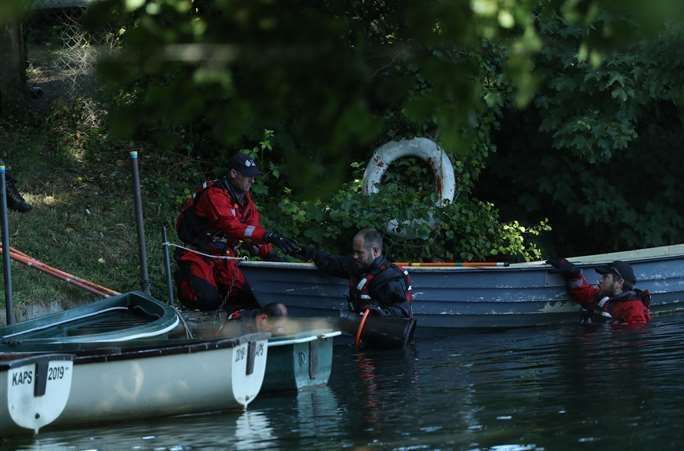 Police forensic officers gather evidence in the grounds of Lullingstone Castle. Pic: Yui Mok/PA