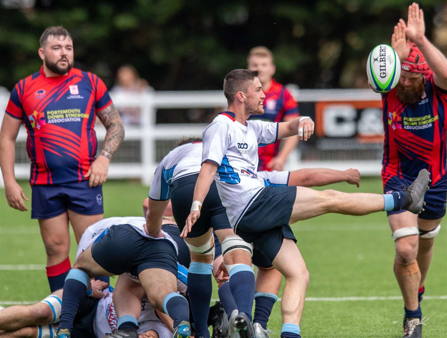 A Hampshire player attempts to charge down a Kent kick. Picture: Mark Deller of Windandsurf Images