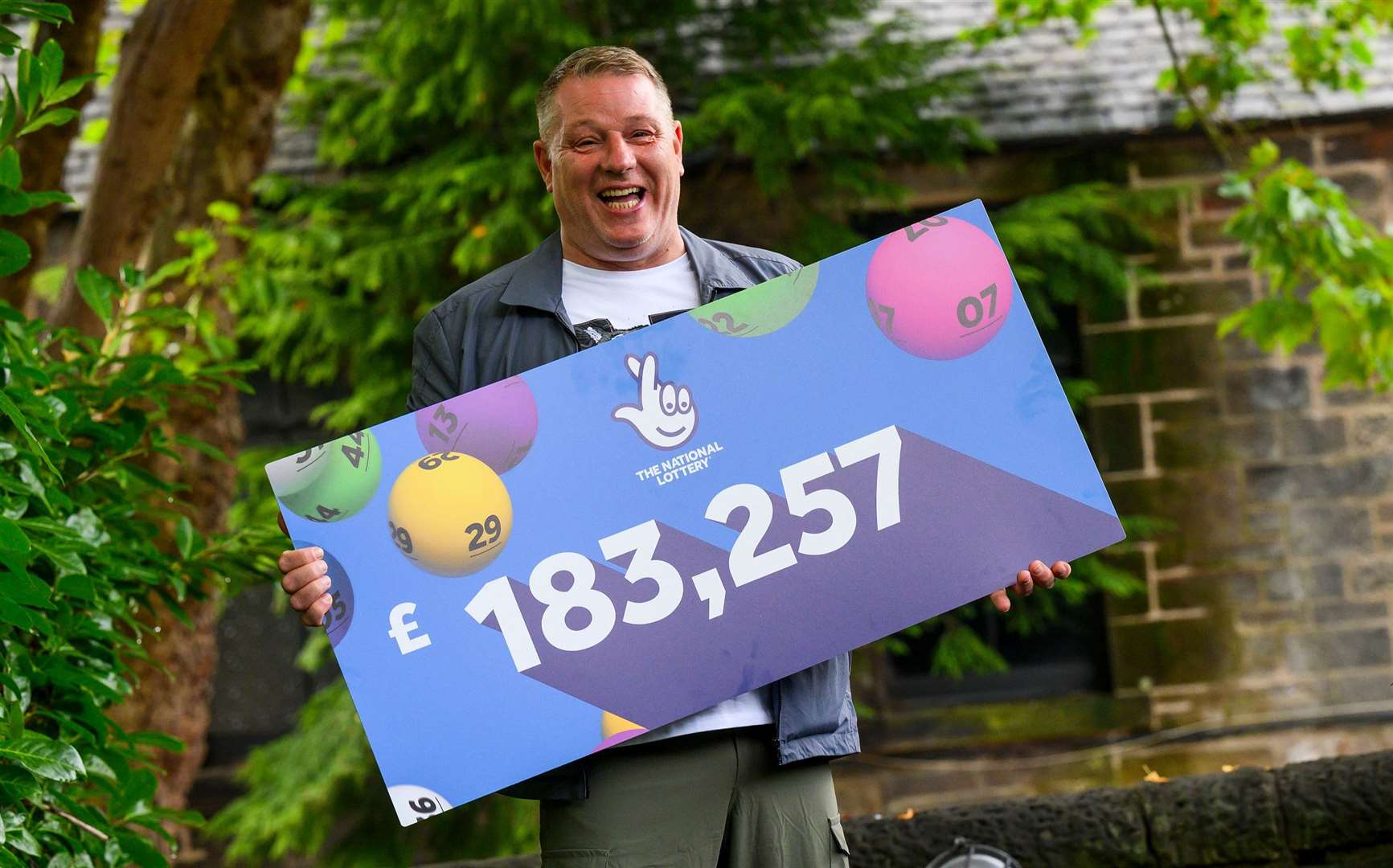 John McDowell, from Bathgate, West Lothian, celebrates winning the EuroMillions (Alan Peebles/PA Wire)