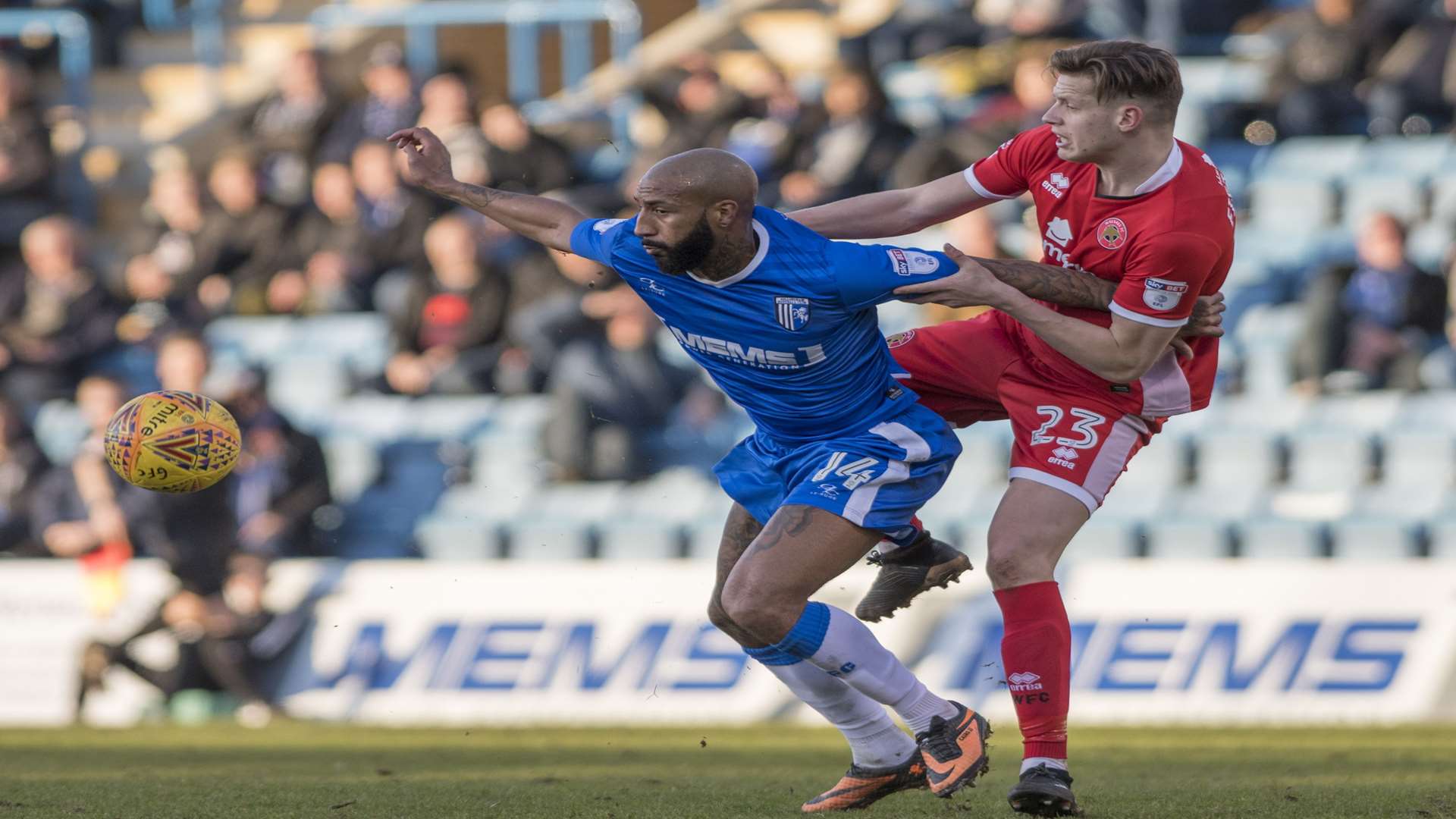 Josh Parker does battle with Walsall's Jack Fitzwater Picture: Andy Payton