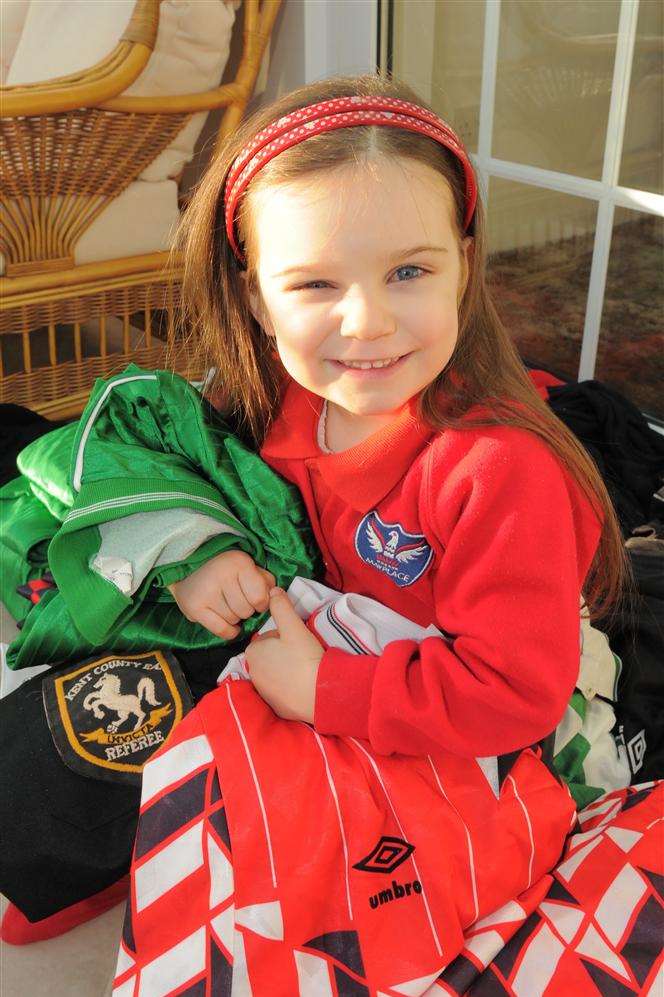 Roger Hosking's granddaughter Rosina with some of the donated shirts