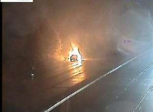 The car on fire. Picture via Highways Agency.