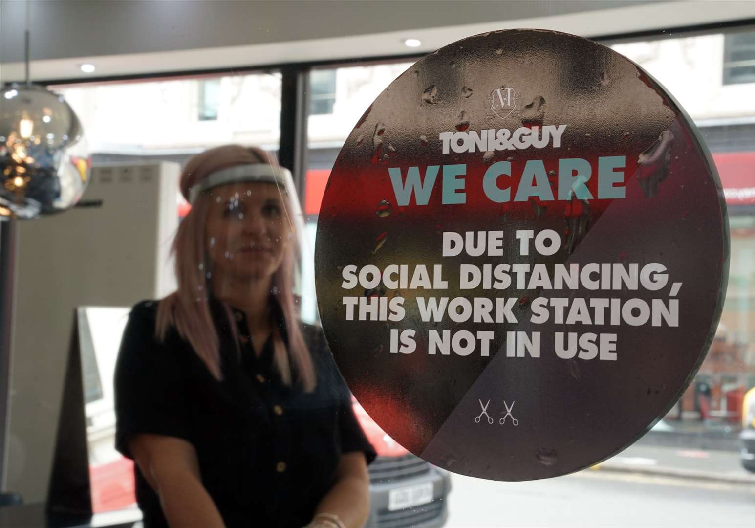 In Newcastle, stylist Caroline Peacock puts the final preparations in place at a Toni & Guy salon (Owen Humphreys/PA)