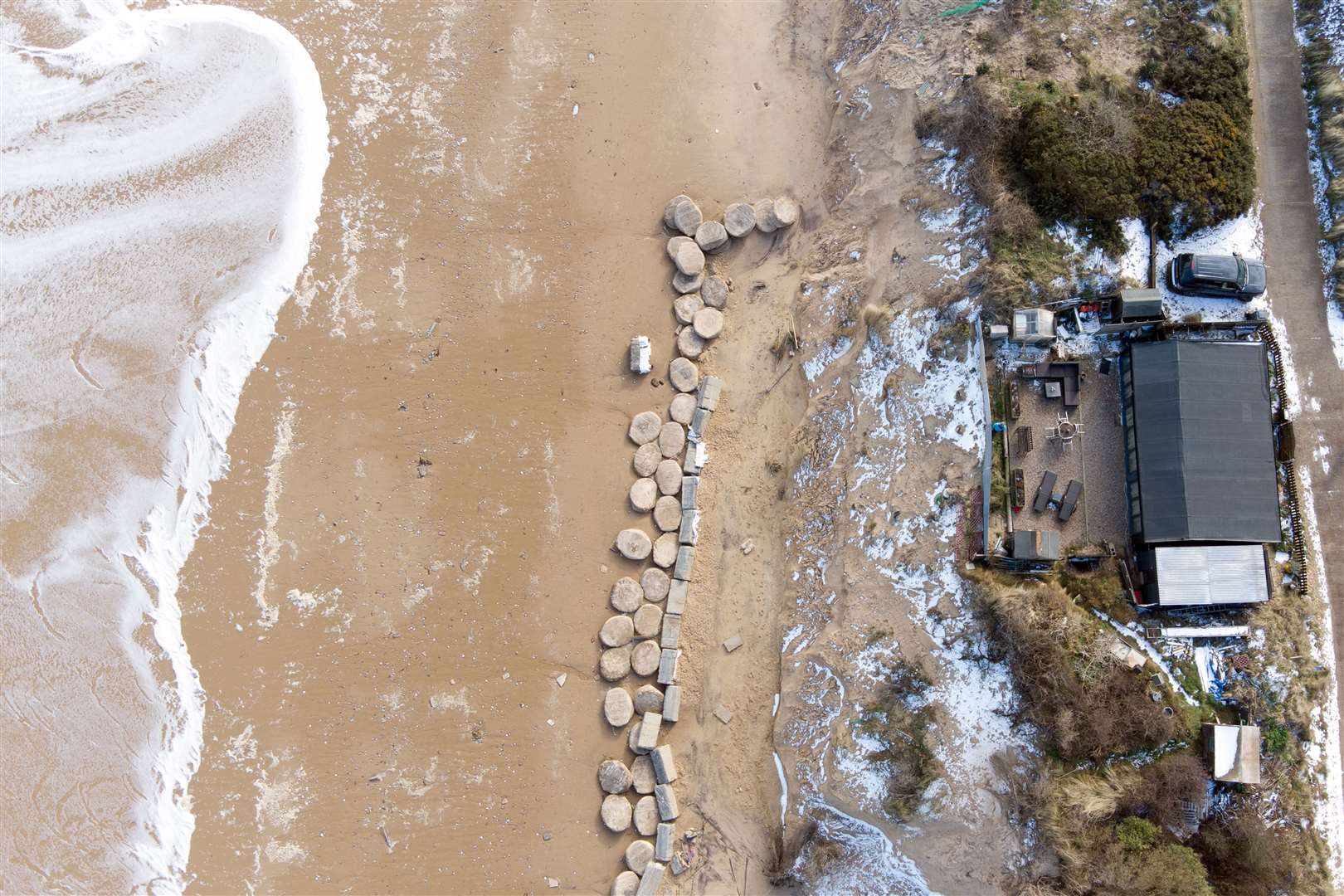 Mr Martin is hoping to rearrange his concrete block sea defences to protect his home (Joe Giddens/ PA)