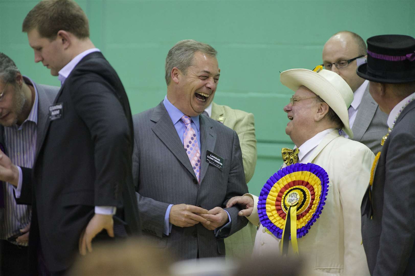 Nigel Farage meets a campaigner from the Official Monster Raving Loony Party at the count