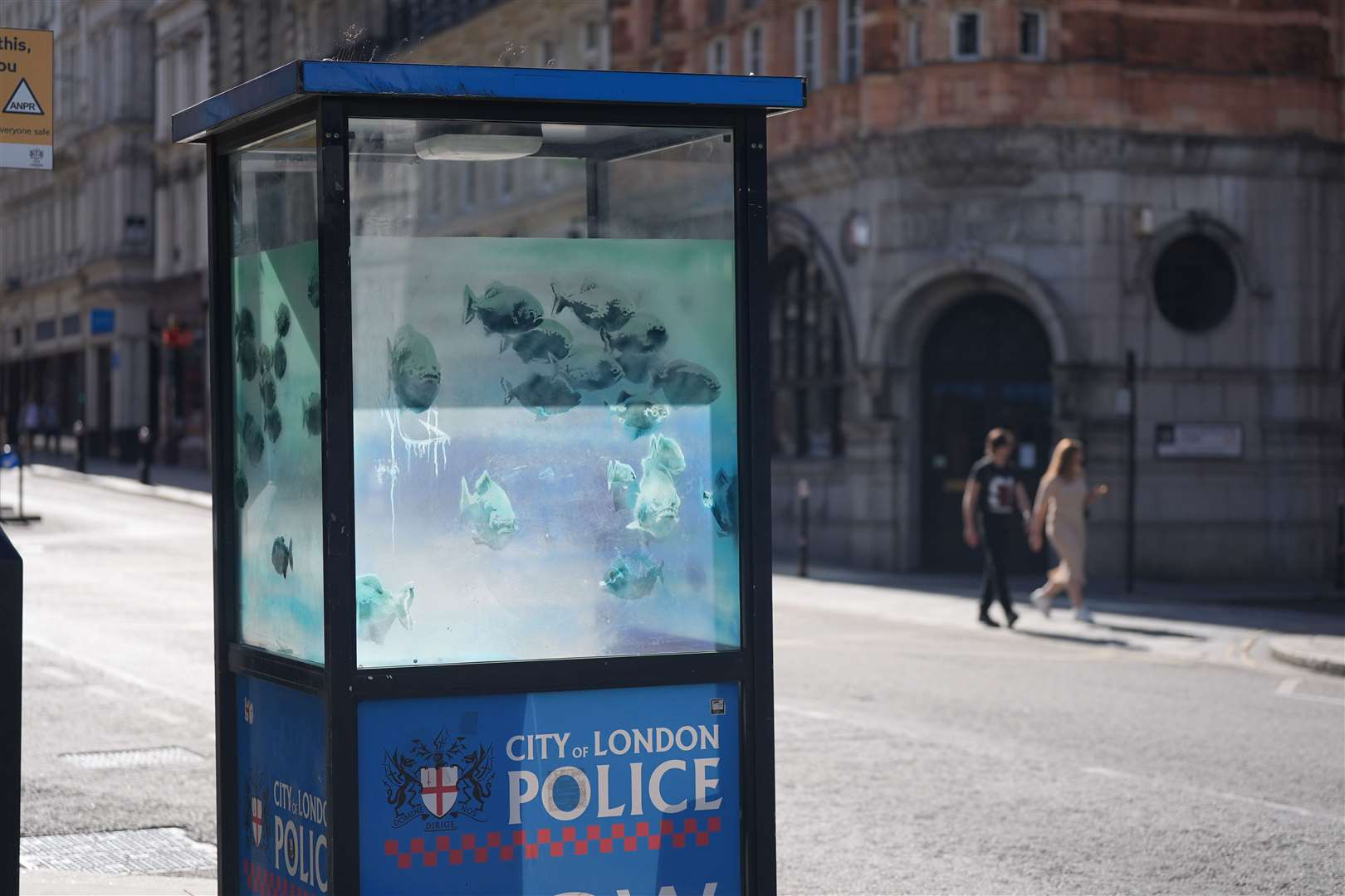 Barriers erected around Banksy’s new piranha artwork on London police box