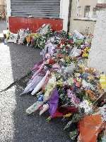 Flowers laid at the scene of the fatal crash. Picture: PETER STILL