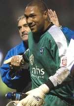 RECALLED: Jason Brown is congratulated by assistant manager John Gorman after his clean sheet against Watford. Picture: GRANT FALVEY