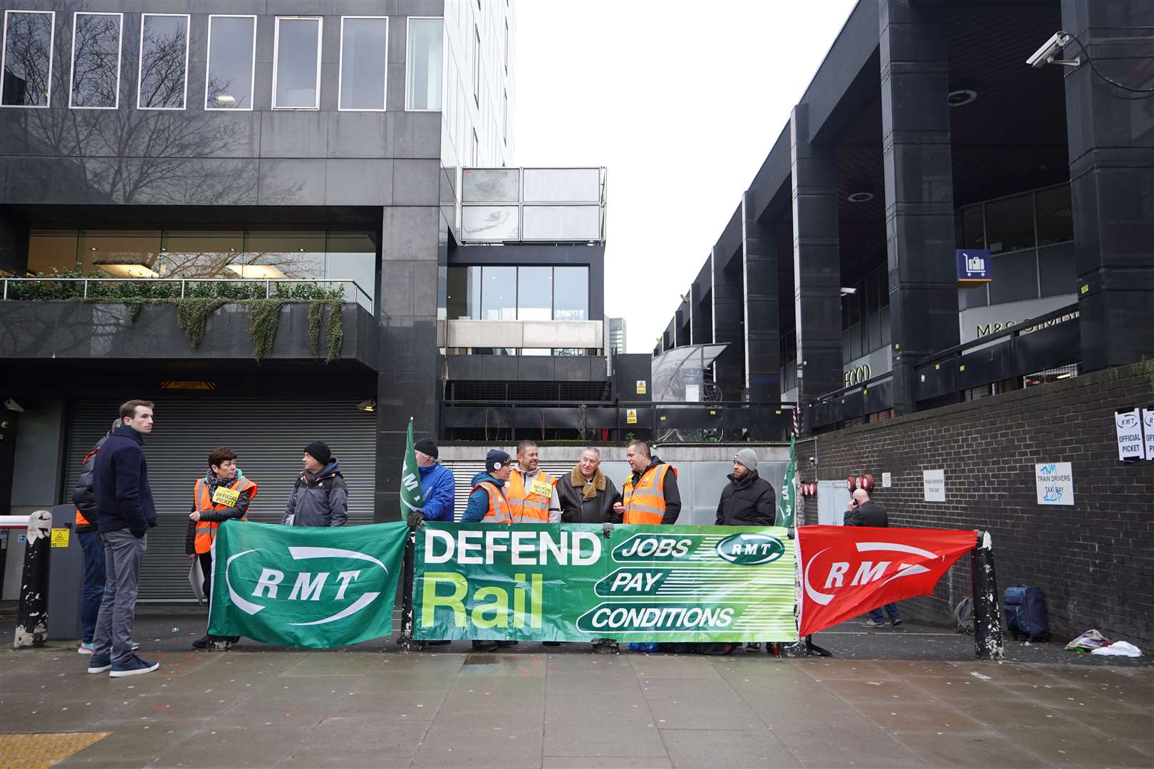 Members of the Rail, Maritime and Transport union on the picket line outside Euston station in London during a rail strike (James Manning/PA)