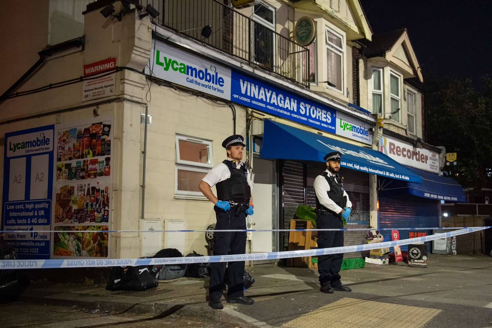 Police at the scene in Aldborough Road North, Ilford (Dominic Lipinski/PA)