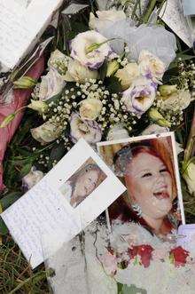 Floral tributes at the spot where Natalie Jarvis was found stabbed to death in Swanley Village