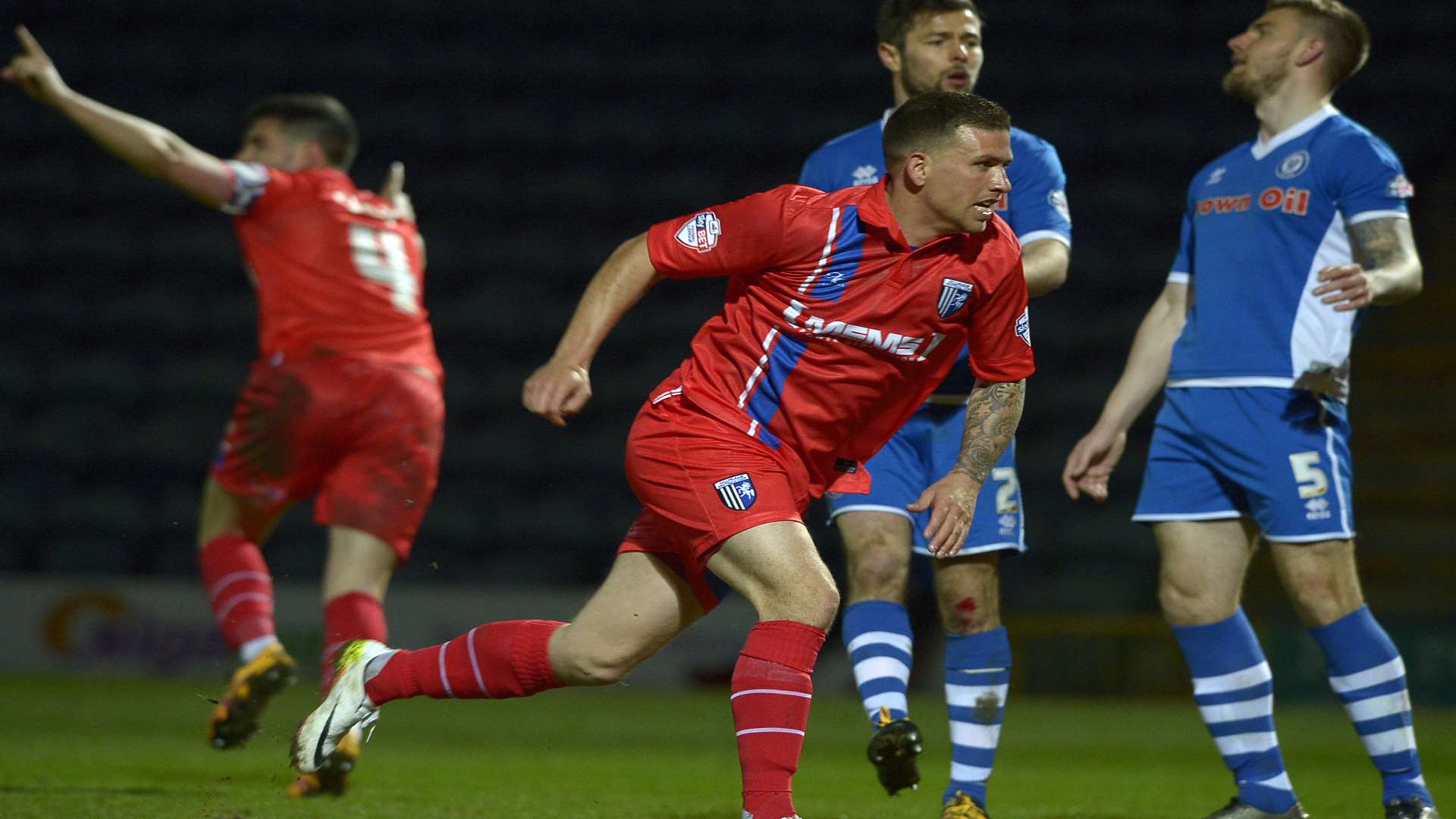 Cody McDonald is eager to get on with it while John Egan, background, celebrates his late leveller against Rochdale Picture: Barry Goodwin