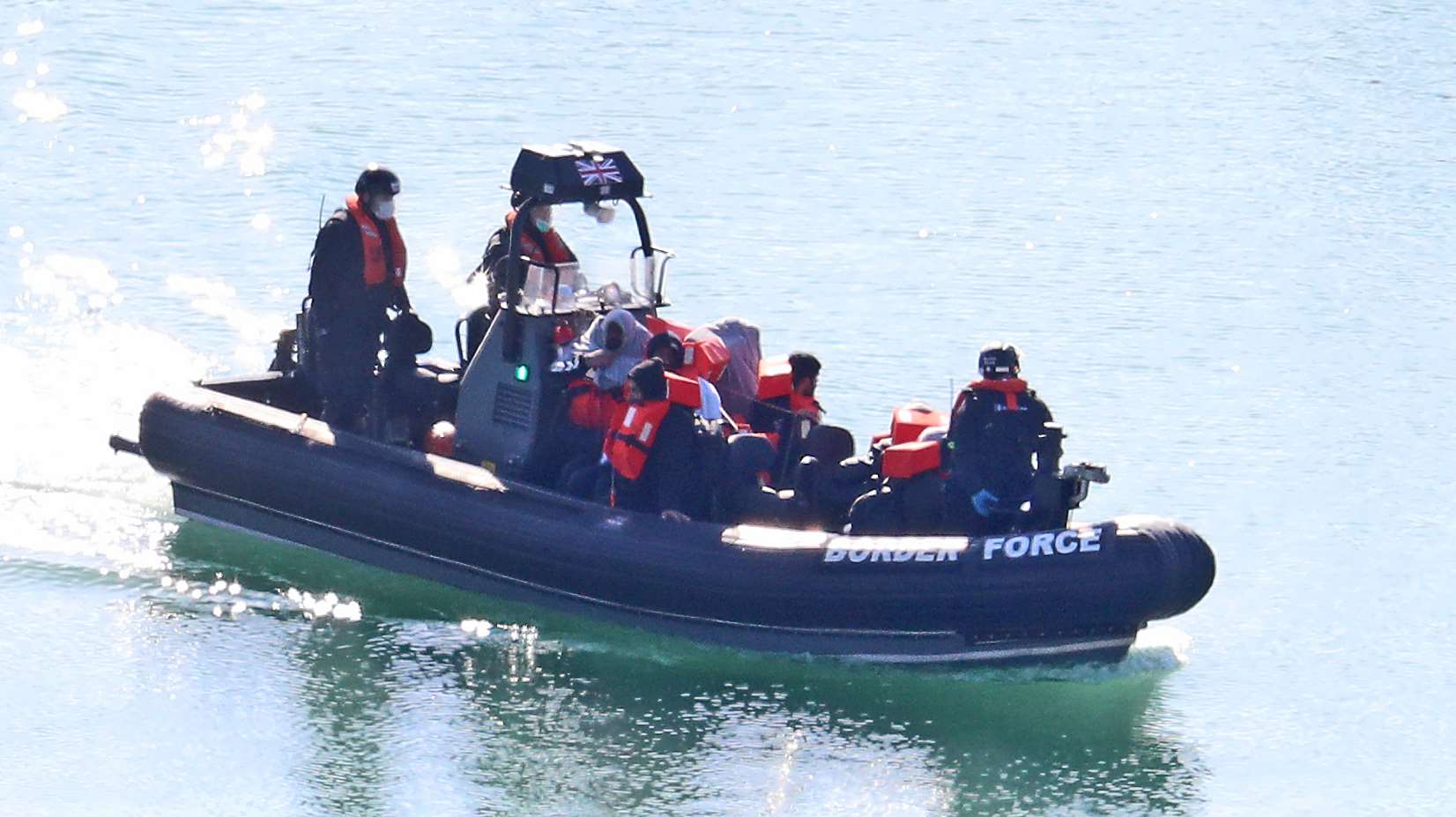 Border Force officers bring to shore men thought to be migrants in Dover (Gareth Fuller/PA)