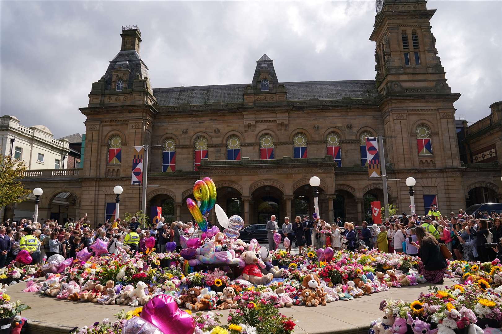 Tributes were left near the town hall where a vigil was held the night after the attack on July 29 (Owen Humphreys/PA)