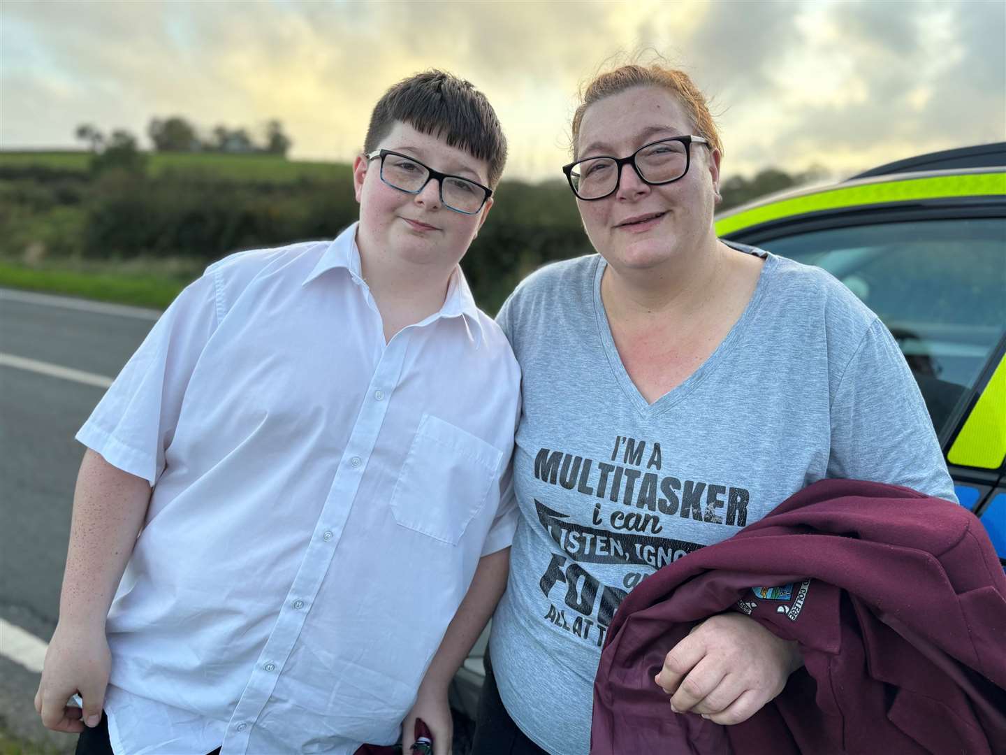 Dylan Lee, 12, and his mother Stacey Lee on the outskirts of Newtownards following a school bus crash (Rebecca Black/PA)