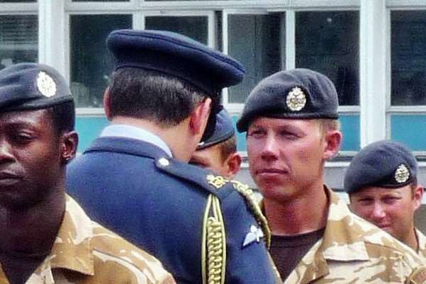 Christopher Pollitt receiving his passing out medal
