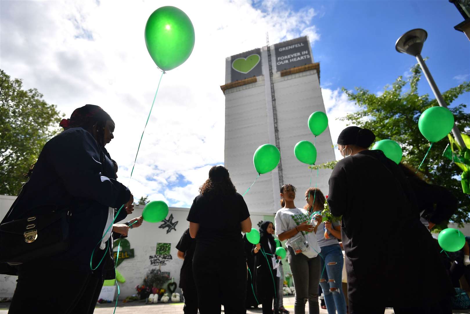 Green balloons have been released at the site of the tower to mark the anniversary (Victoria Jones/PA)