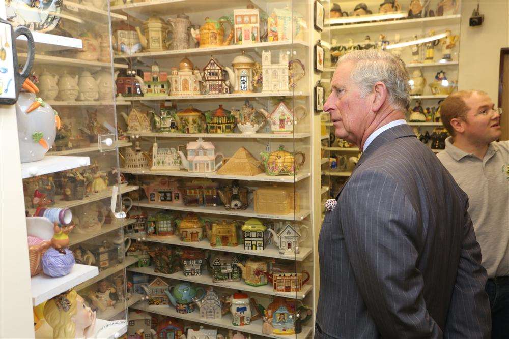 The Prince of Wales browsing teapots in Teapot Island. Picture: Martin Apps