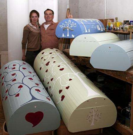 Andy Clarke and partner Holly Bridgestock-Perris with their unique curved coffins.
