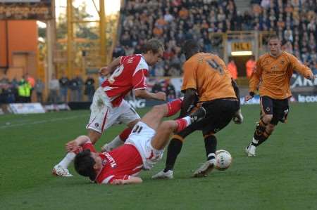 Svetoslav Todorov is barged to the floor by the Wolves defence; Picture: BARRY GOODWIN