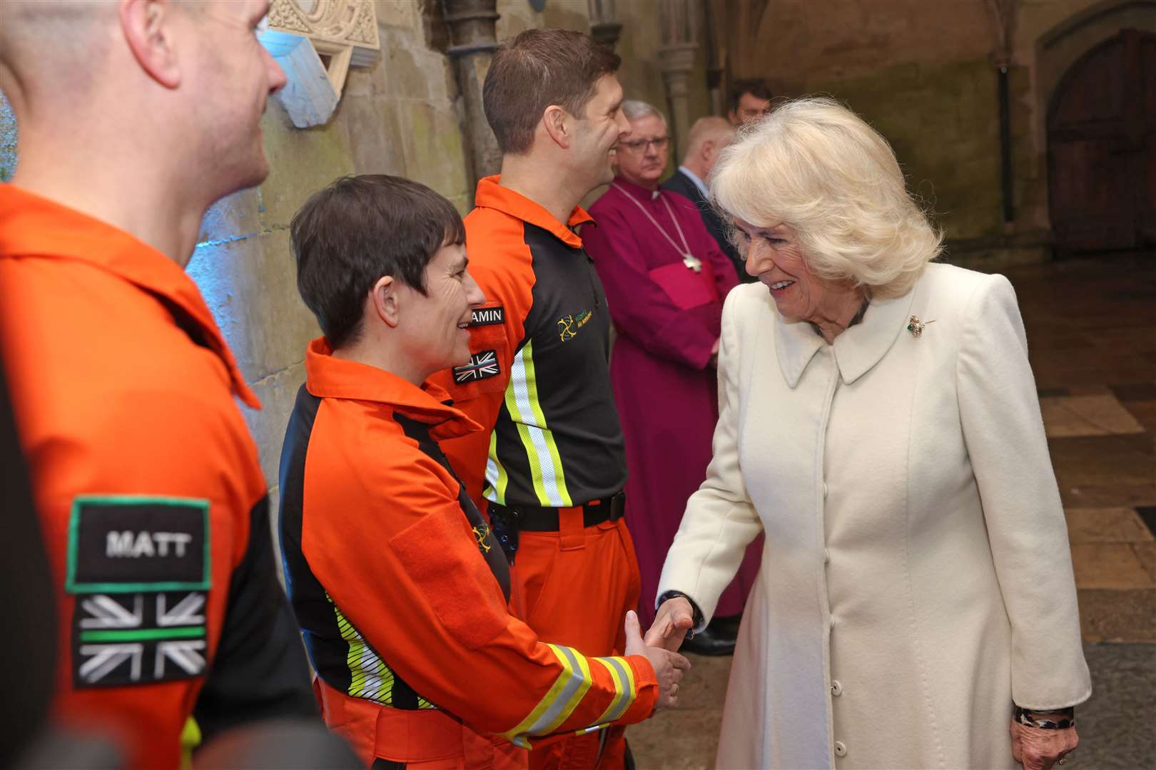 Queen Camilla is greeted by air ambulance charity reps as she attends a musical evening at Salisbury Cathedral in Wiltshire just days after the King’s diagnosis was made public (Chris Jackson/PA)