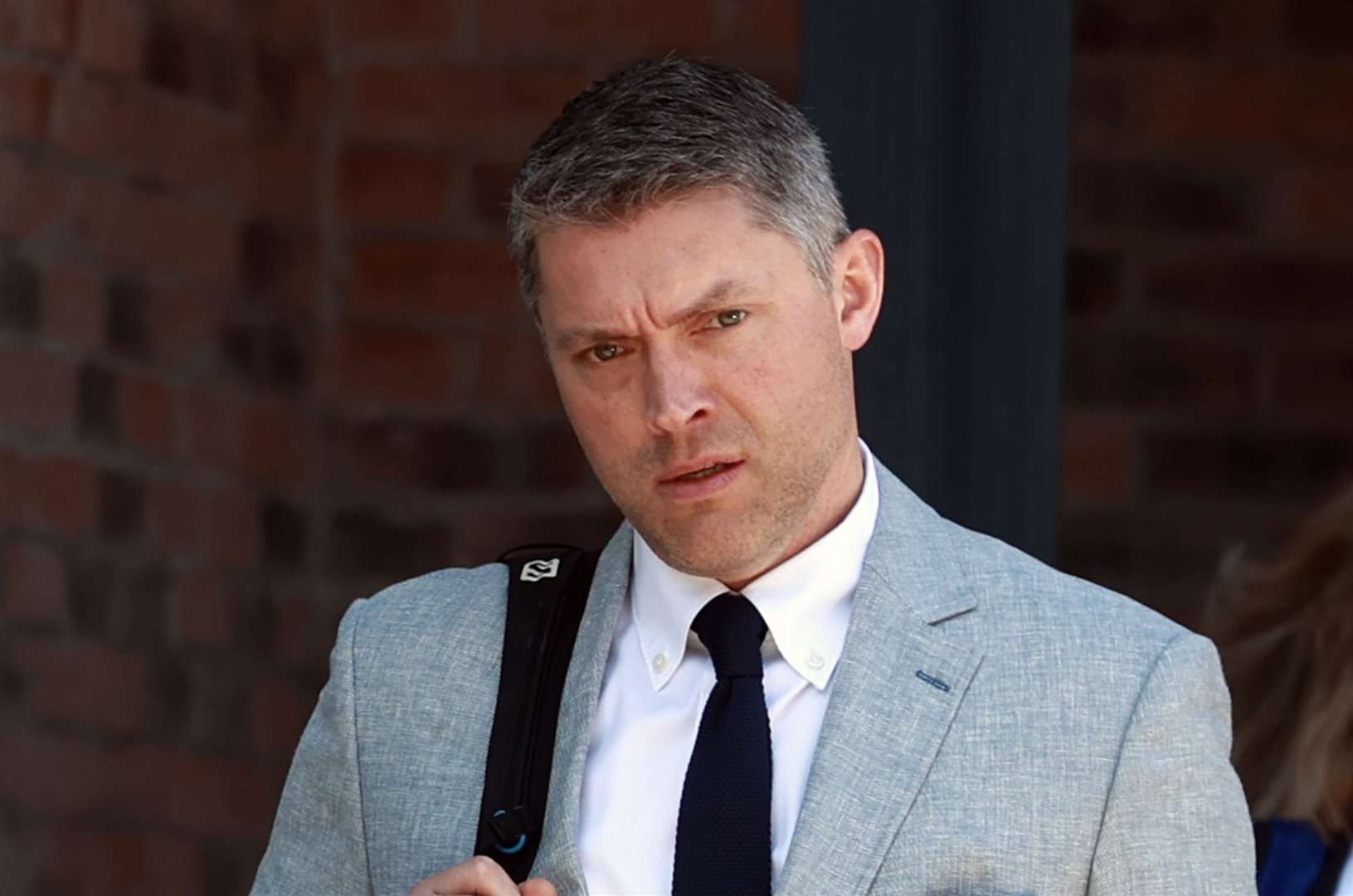 Adam Smyth, director of BBC Northern Ireland, leaves the Office of the Industrial Tribunals, Killymeal House, Belfast (Liam McBurney/PA)