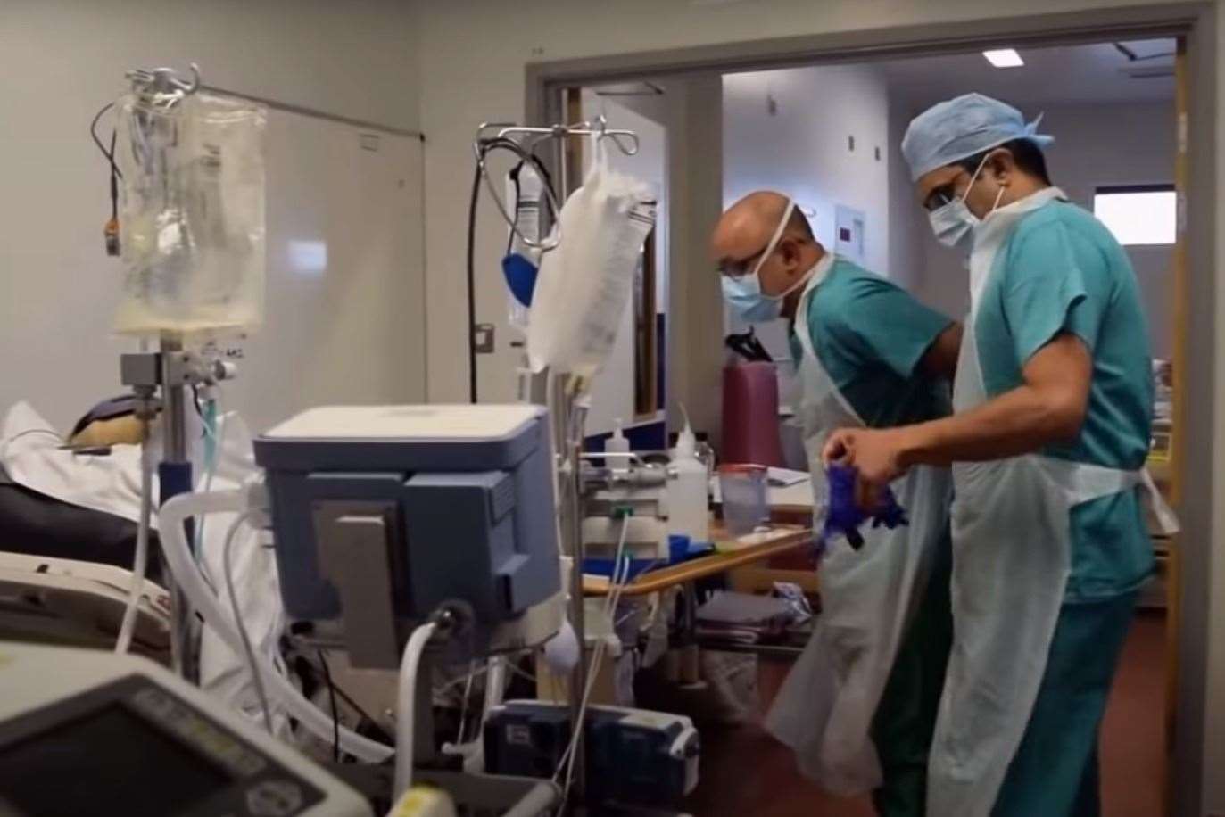 Staff treating a patient on one of the wards at Darent Valley Hospital Photo: DVH