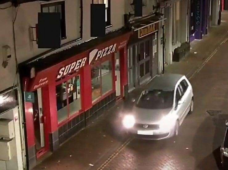 Ashmit Limbu driving on the pavement outside Super Pizza in New Street, Ashford