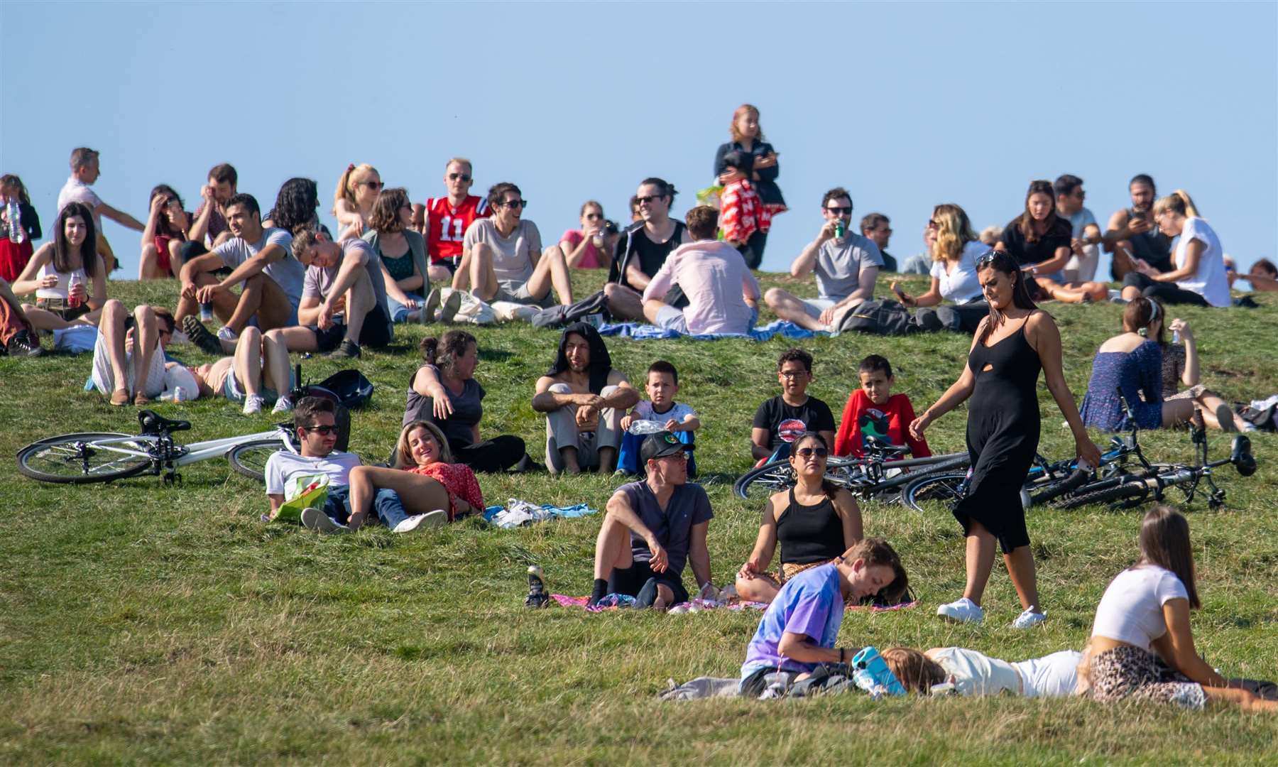 People enjoying the Autumn sunshine on Primrose Hill, London, on Sunday (Dominic Lipinski/PA)