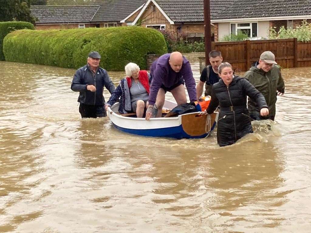 Elderly residents are rescued in the village of Debenham, Suffolk (Mary Scott/PA)