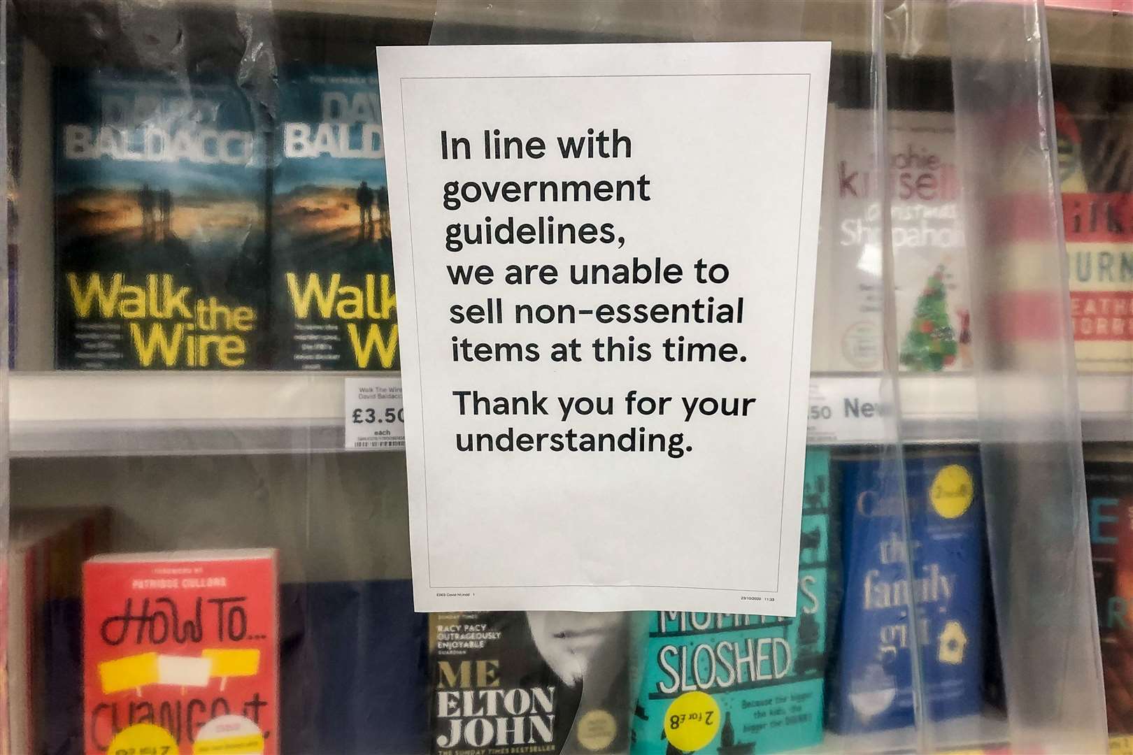 Books have been covered with plastic sheeting in some supermarkets (Ben Birchall/PA)