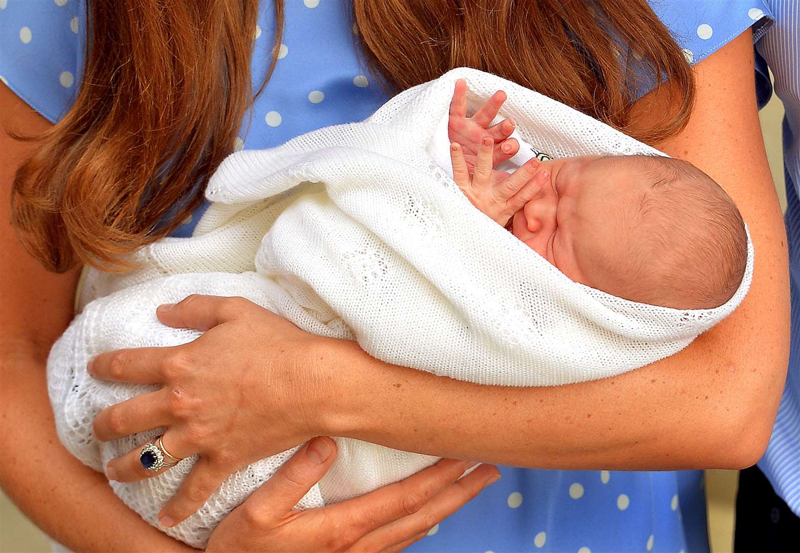 George was introduced to the world on the day he was born, carried out of the Lindo Wing of St Mary’s Hospital in west London by his mother (John Stillwell/PA)