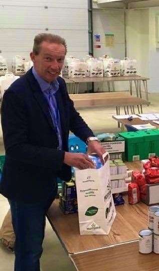 Dover District Council leader Cllr Trevor Bartlett lending a hand to pack food parcels at the coronavirus community hub