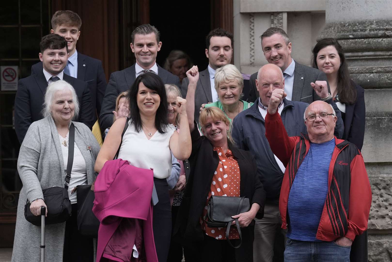 Families, supporters and solicitors involved in the appeal against the Legacy Act celebrate after Friday’s judgment (Brian Lawless/PA)