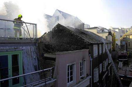 Fireifghters tackling the blaze in Folkestone from rooftops