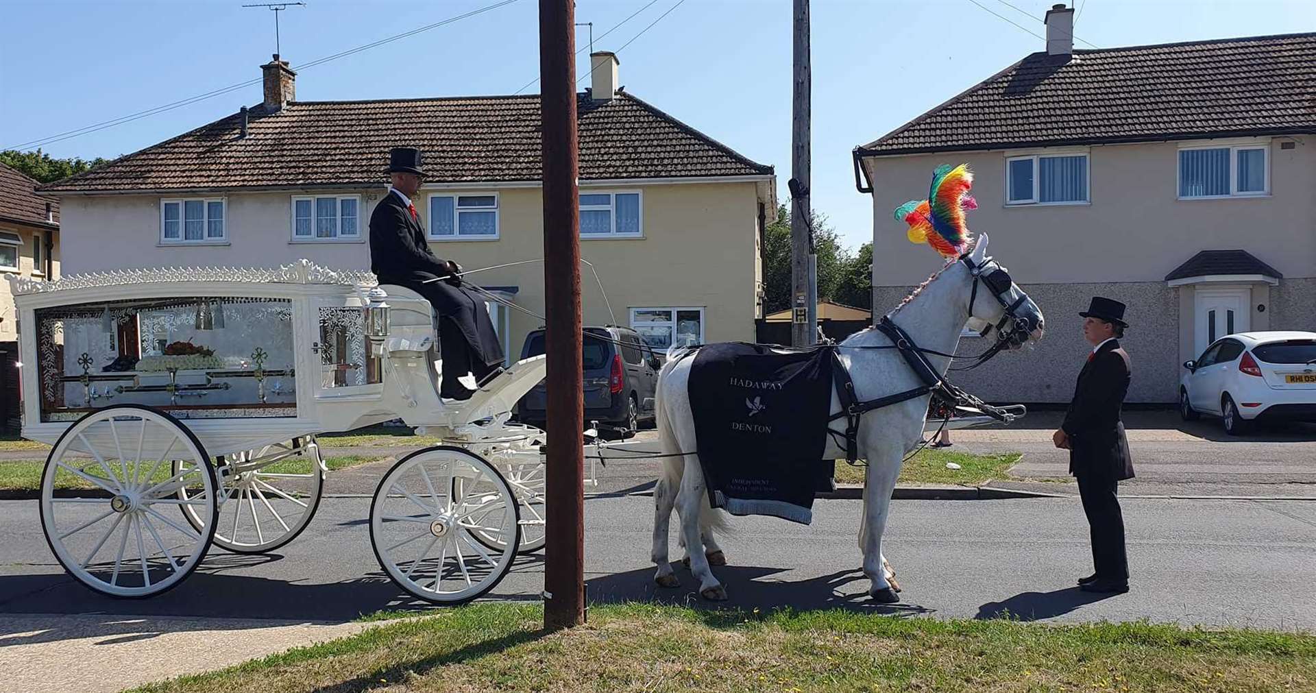 Mark Goodwin was taken on his final journey through Ashford in vibrant a horse-drawn carriage
