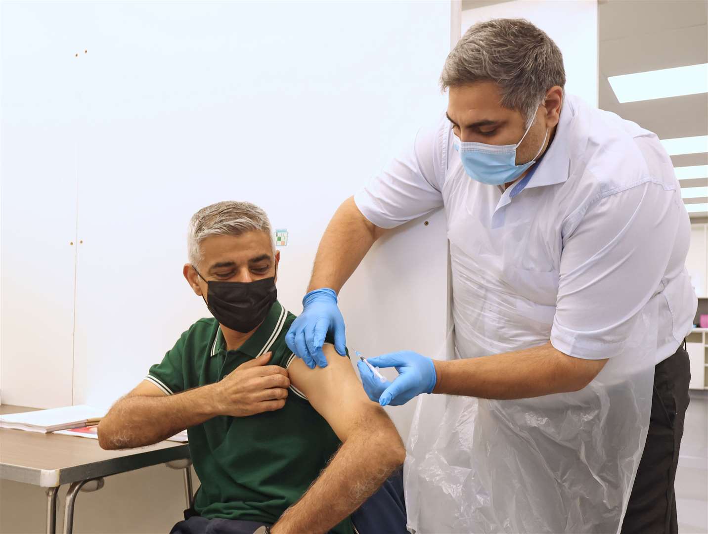 London Mayor Sadiq Khan receives his flu and Covid-19 booster jab (James Manning/PA)