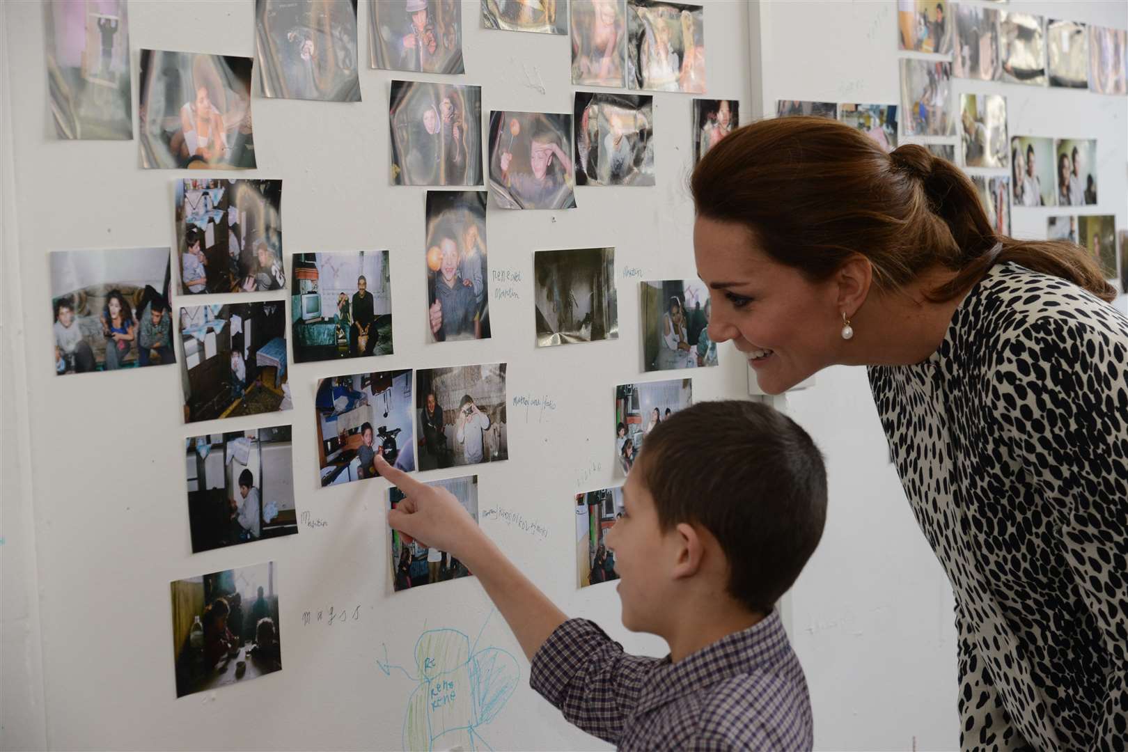 Martin Slepcikova showing the Duchess his montage of photos from Croatia