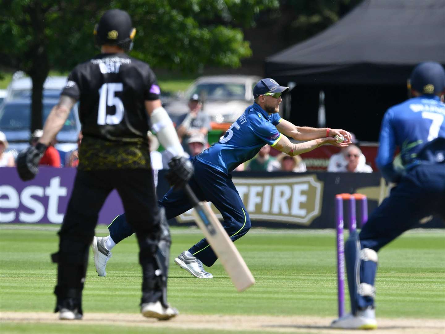 Kent's Calum Haggett catches Gloucestershire's Chris Dent on Sunday. Picture: Keith Gillard