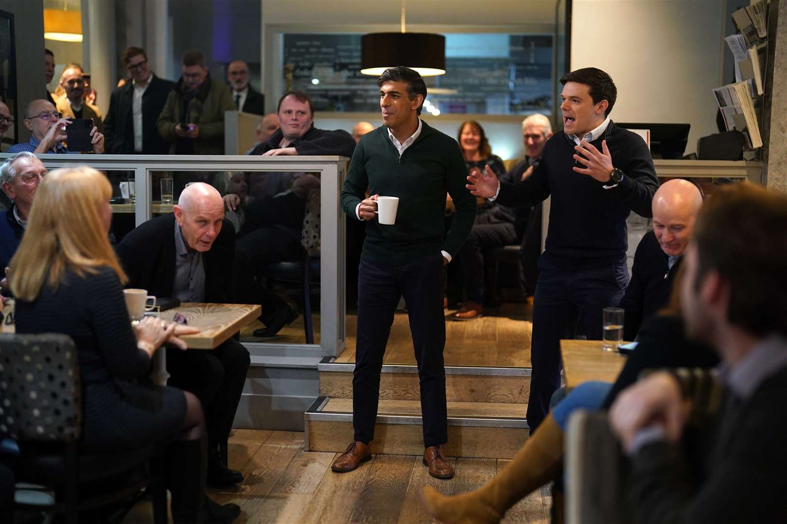 Prime Minister Rishi Sunak (centre) during a visit to La Dolce Vita cafe in Marple, Stockport (Jacob King/PA)