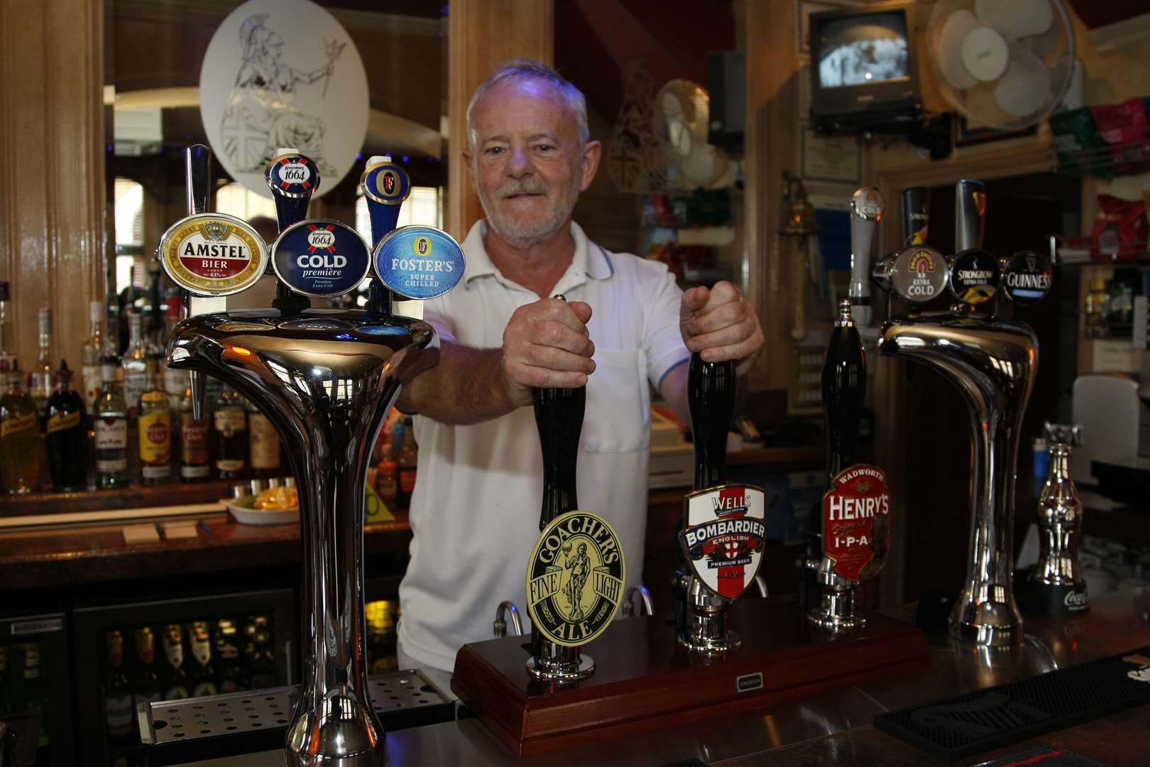 John Baker behind the pumps at the High Street pub